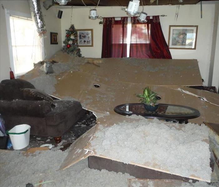 drywall and insulation covering a living room floor