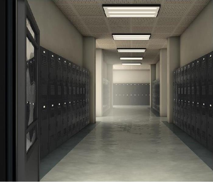 Hallway view of school; lockers on both sides of hall