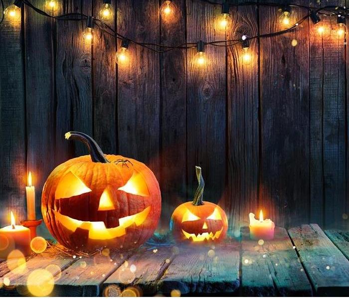 Jack O' Lanterns - Candles And String Lights On Wooden Table